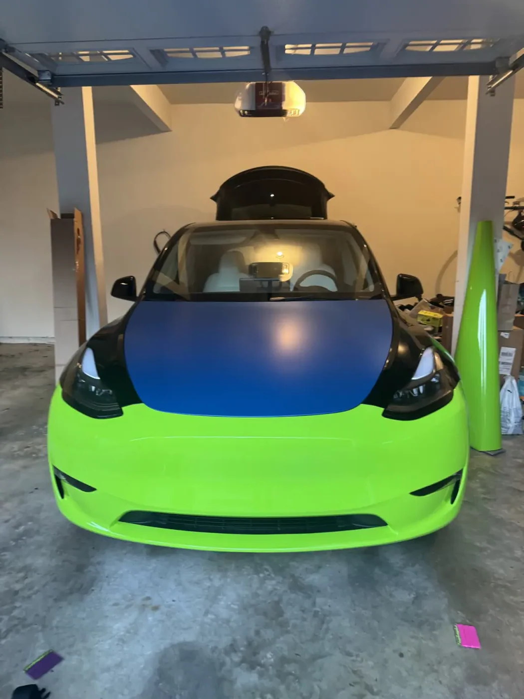 A Tesla mid-wrap inside a customer’s own garage