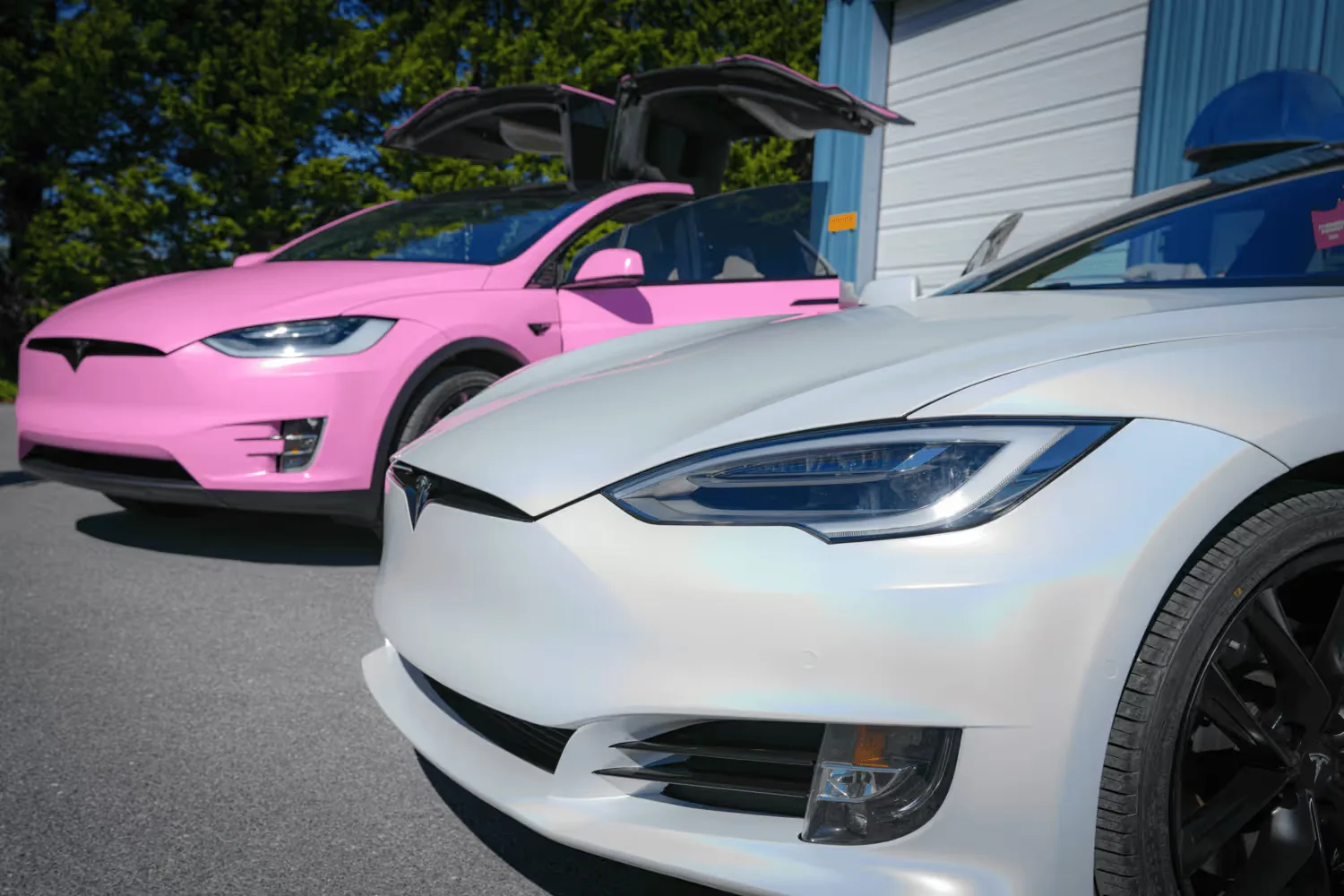 Wrapped Teslas outside the Tesla Wrapper install bay