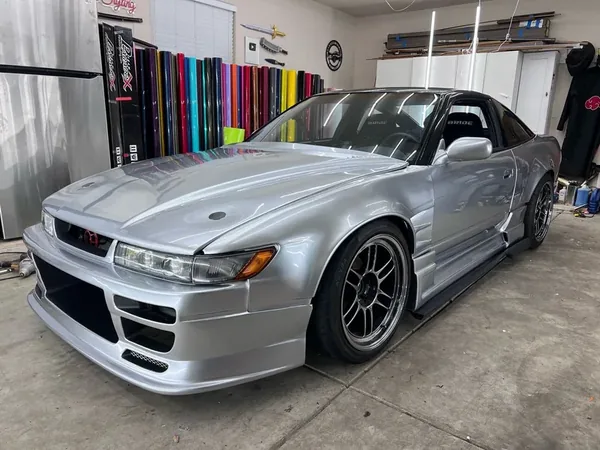 A car finished in Paradox Supreme Color PPF Cosmic Silver, wrapped by Paradox