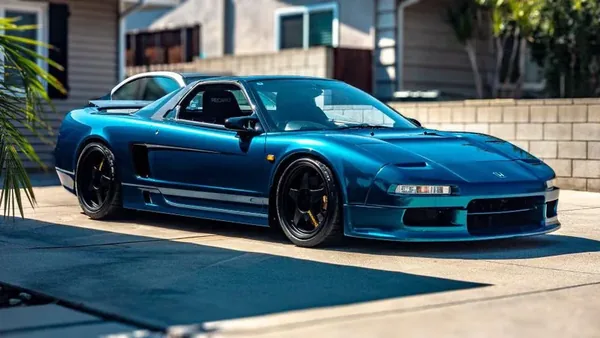 A car finished in Paradox Supreme Color PPF Shadow Blue, wrapped by Paradox