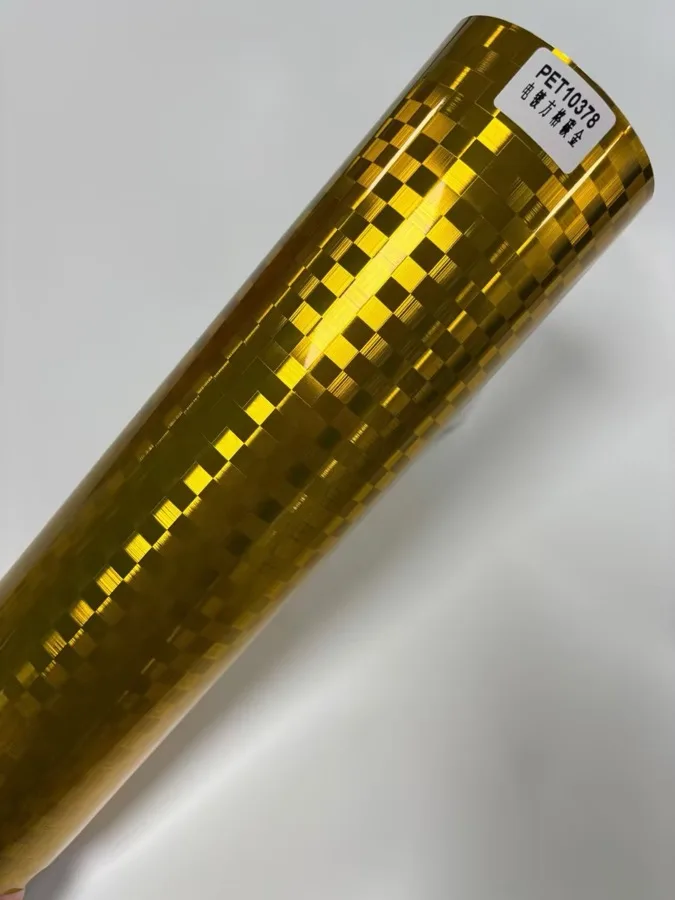 TeslaWrapper Space Film in Gloss Chrome Checkered Carbon Gold
